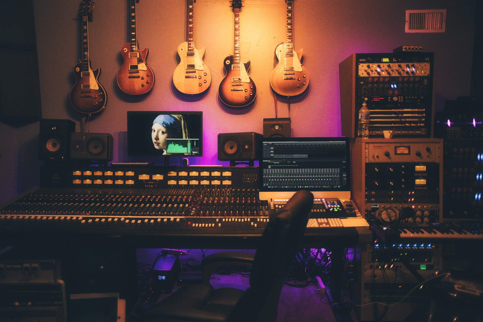 A mixing console and studio desk in a recording room
